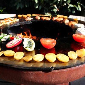 Yagoona wood fire ring grill barbecue in action 80cm Haus Collective Brisbane Gold Coast Sunshine Coast Northern Rivers1
